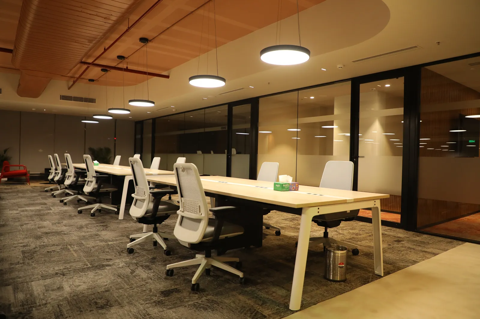Open plan workspace with pendant lights